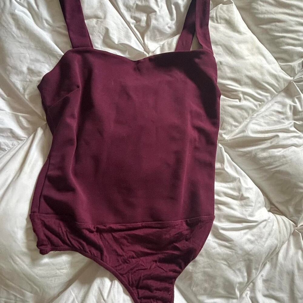 Burgundy bodysuit fits true to